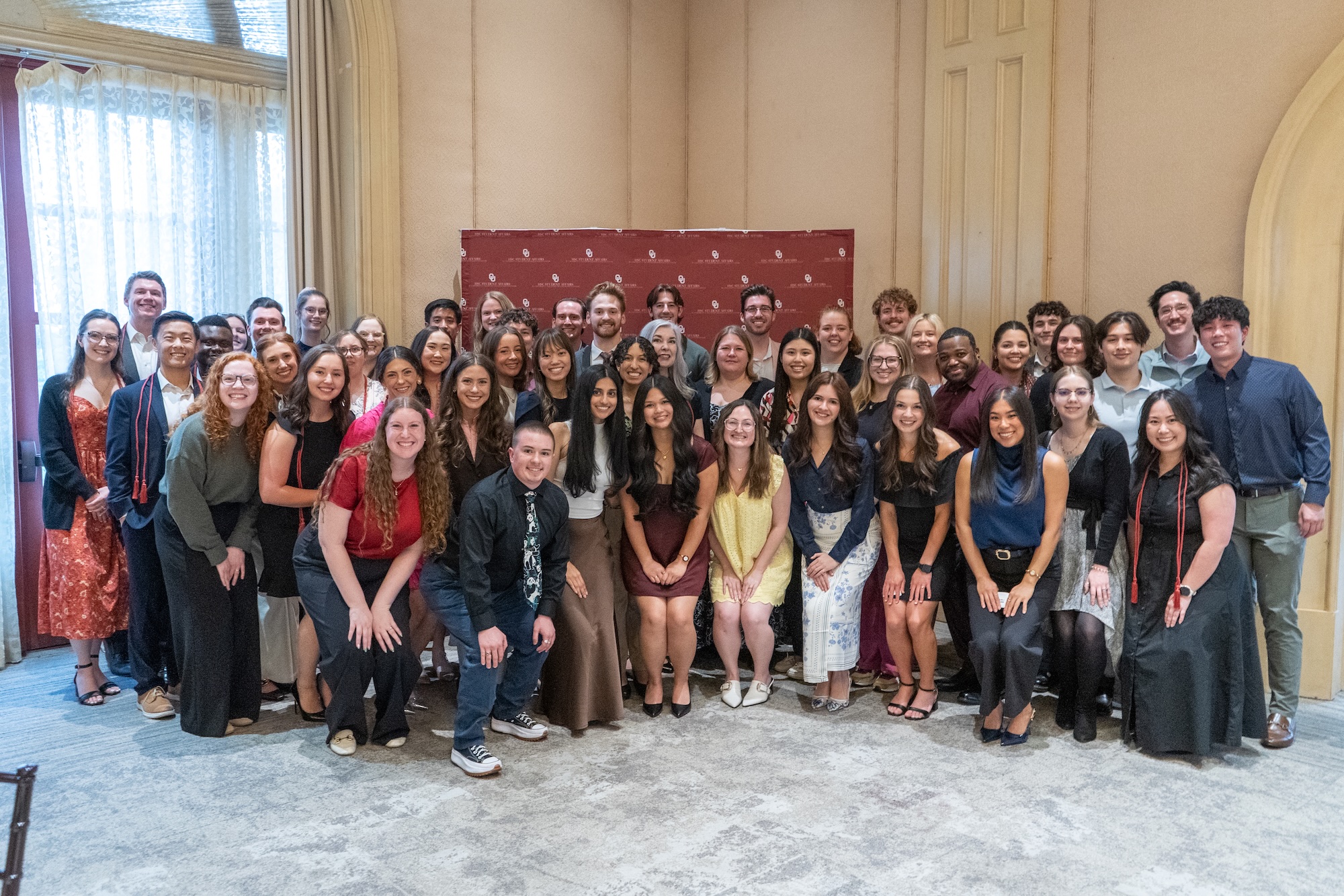 The 2026 Crimson Club poses for a group photo at Faculty House.